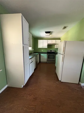 a workspace with furniture and stairs