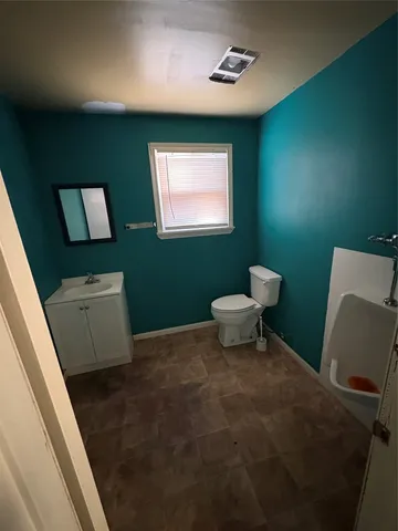 a view of empty room with garage and windows