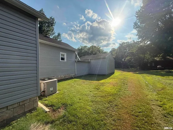 a swimming pool view with a outdoor seating space