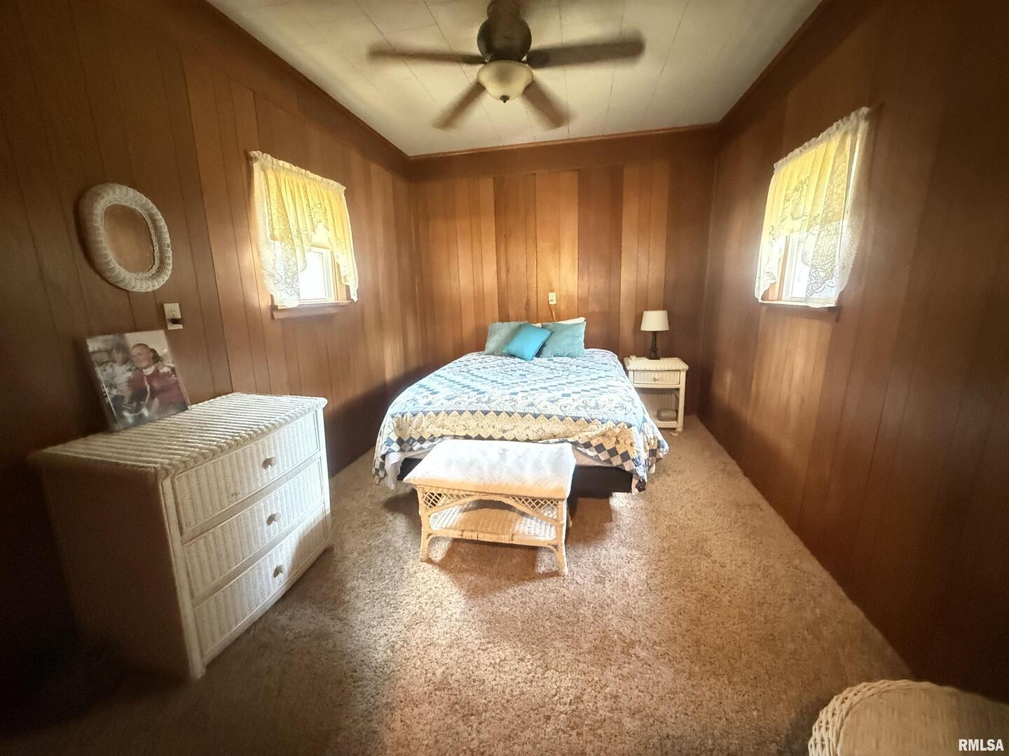 401 North 23rd Street Herrin, IL 62948 - Photo 10 of 23 a spacious bedroom with a bed and a chandelier