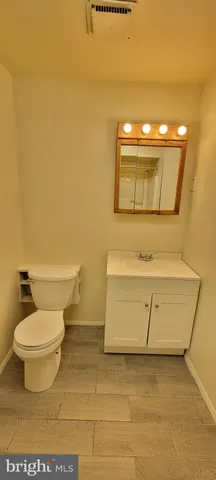 a bathroom with a toilet and a sink