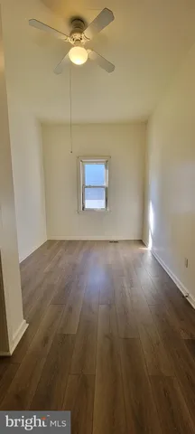 a view of room with wooden floor