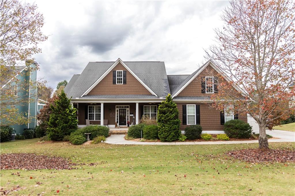 a front view of a house with garden