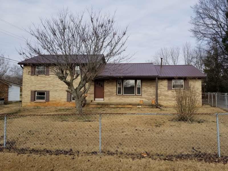 405 Burch Road Clarksville, TN 37042 - Photo 1 of 30 a front view of a house with garden
