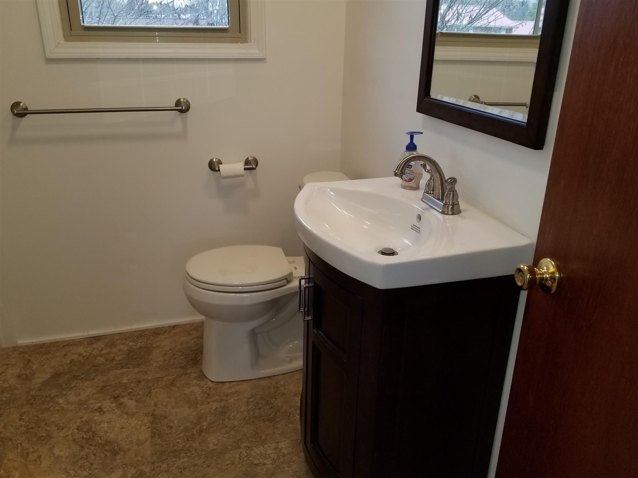 405 Burch Road Clarksville, TN 37042 - Photo 21 of 30 a bathroom with a sink toilet and a mirror