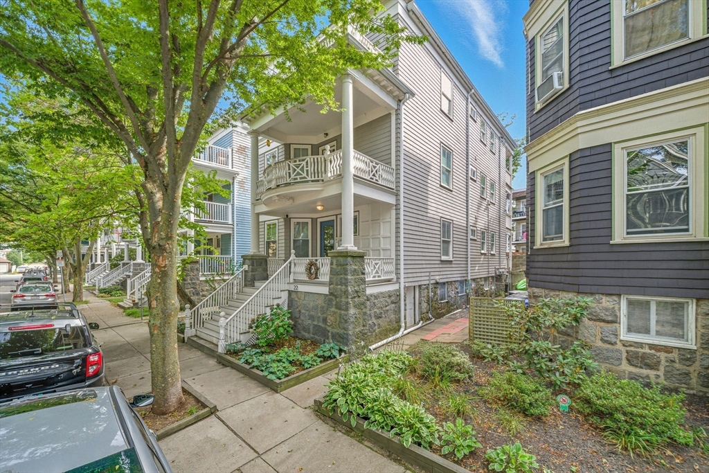 front view of a house with a yard