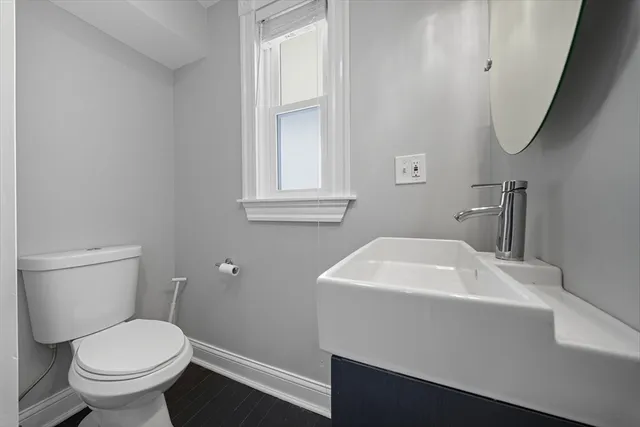 a bathroom with a sink toilet and vanity