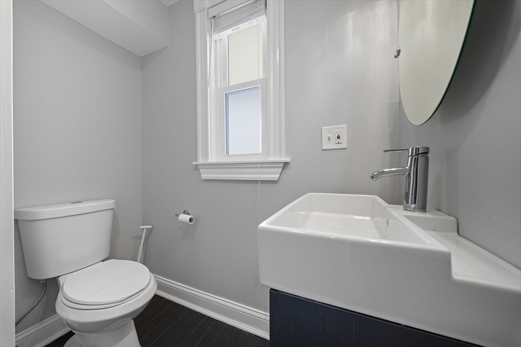 22 Trescott Street, Unit 3 Boston, MA 02125 - Photo 13 of 22 a bathroom with a sink toilet and vanity