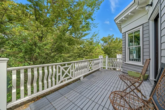 a view of a balcony with wooden floor