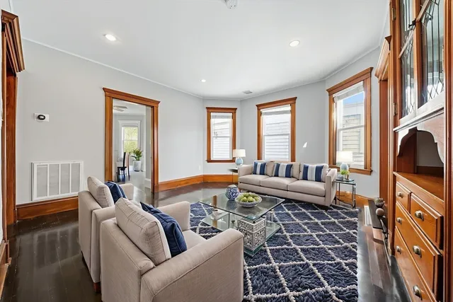 a living room with furniture and a rug