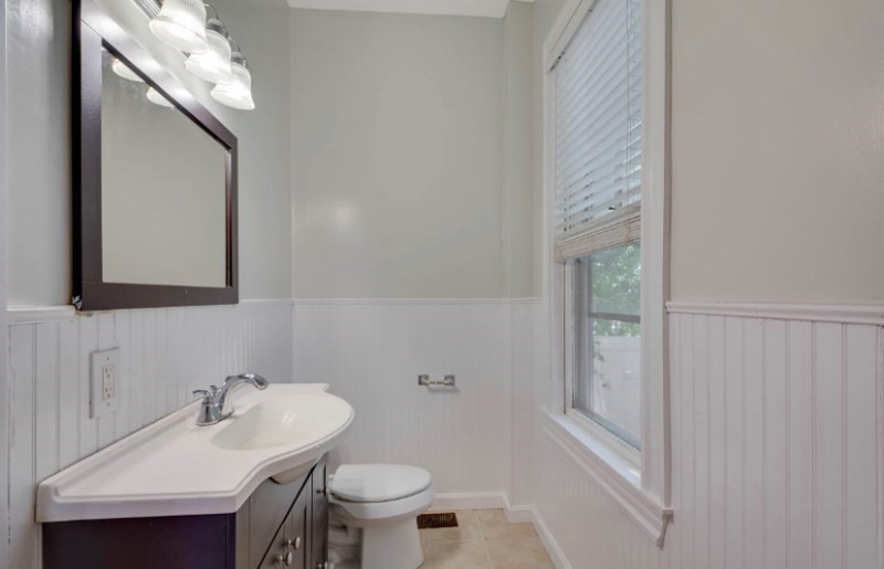 12 Fiske Street, Unit 1 Waltham, MA 02451 - Photo 12 of 18 a bathroom with a sink and a mirror