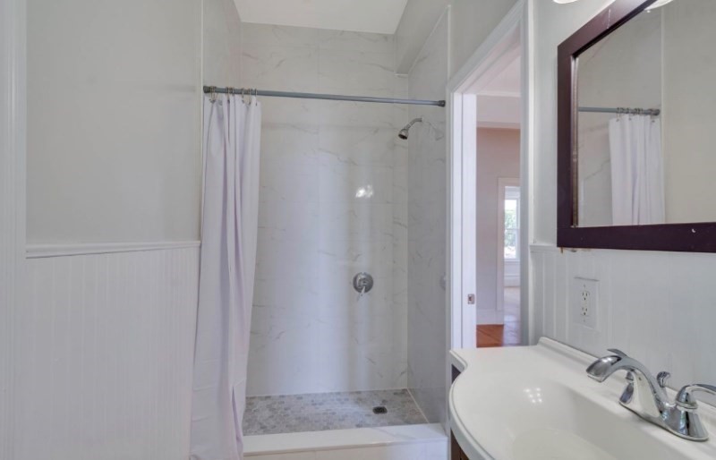 12 Fiske Street, Unit 1 Waltham, MA 02451 - Photo 13 of 18 a bathroom with a shower and a sink