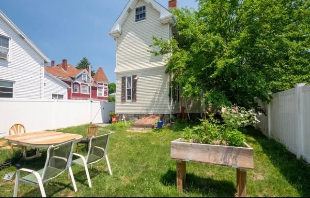 a patio with table and chairs