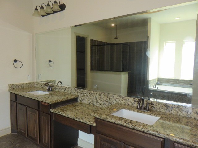 2607 Alan Lake Lane Spring, TX 77388 - Photo 19 of 42 a bathroom with a granite countertop sink and a mirror