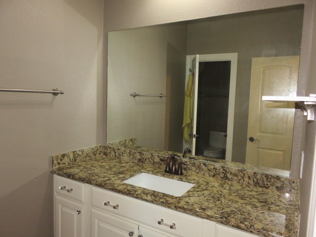 2607 Alan Lake Lane Spring, TX 77388 - Photo 28 of 42 a bathroom with a granite countertop sink and a mirror