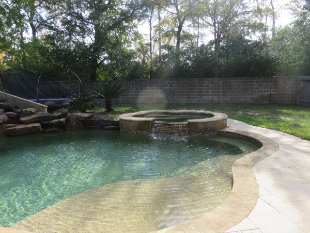 2607 Alan Lake Lane Spring, TX 77388 - Photo 38 of 42 a view of a swimming pool with a patio