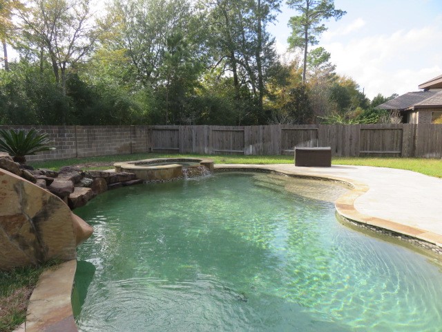 2607 Alan Lake Lane Spring, TX 77388 - Photo 40 of 42 a view of a backyard with swimming pool