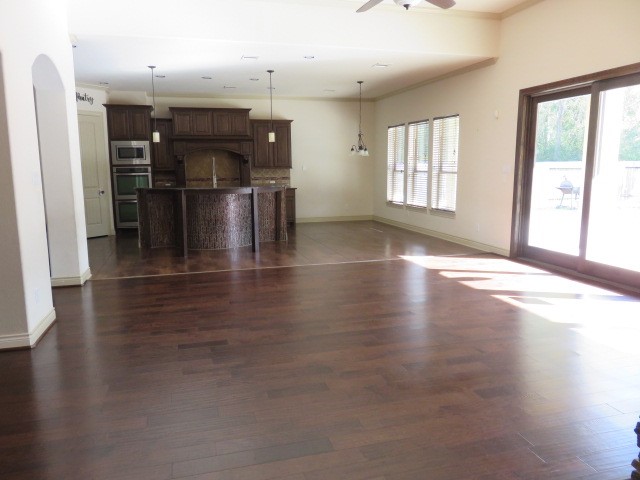 2607 Alan Lake Lane Spring, TX 77388 - Photo 7 of 42 an empty room with wooden floor and windows