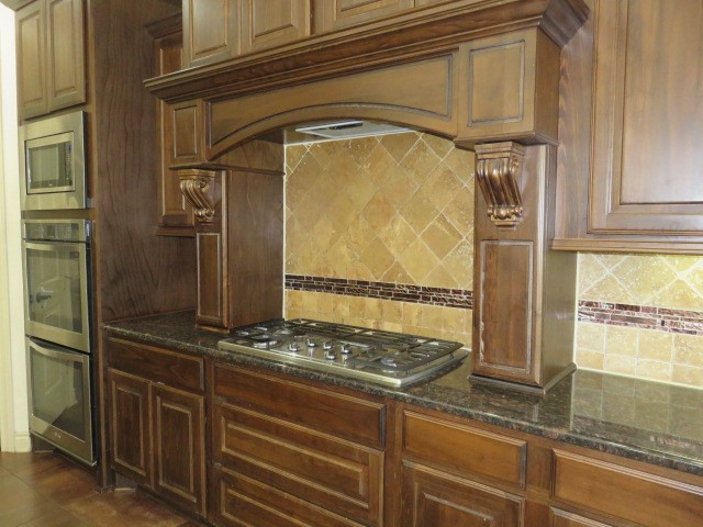 2607 Alan Lake Lane Spring, TX 77388 - Photo 8 of 42 a kitchen with a refrigerator and a stove