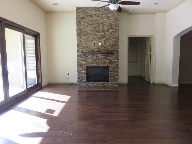 2607 Alan Lake Lane Spring, TX 77388 - Photo 9 of 42 a view of an empty room with exposed radiator and fireplace