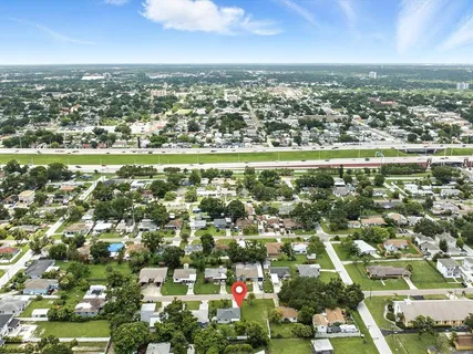 an aerial view of residential houses with outdoor space