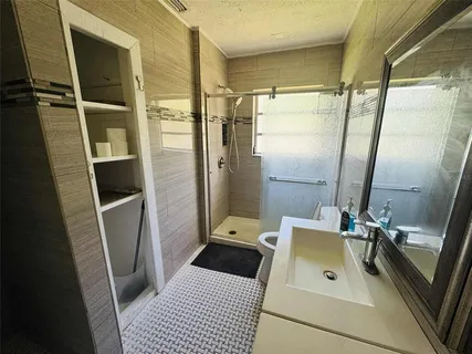 a view of a storage & utility room with washer and dryer