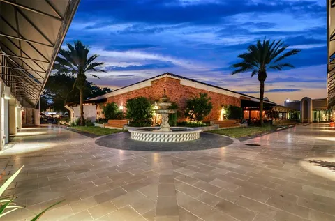 a view of a water fountain in front of house