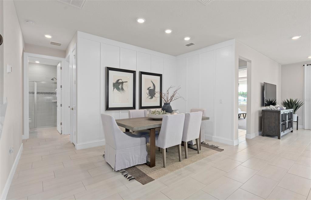 6249 Dew Drop Loop St. Cloud, FL 34771 - Photo 11 of 26 a view of a dining room with furniture