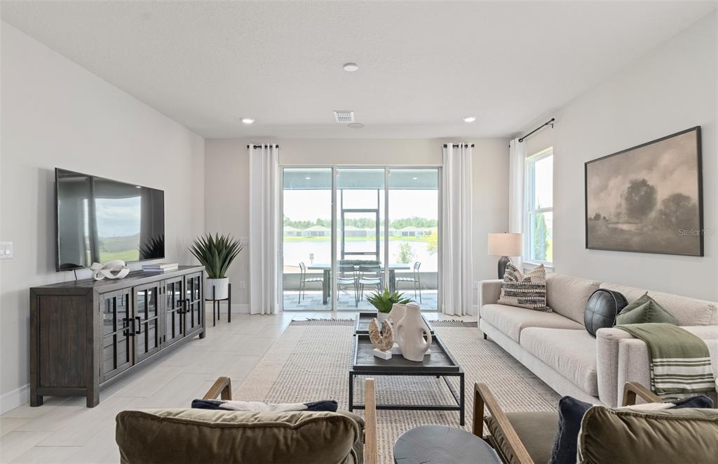 6249 Dew Drop Loop St. Cloud, FL 34771 - Photo 13 of 26 a living room with furniture and a large window