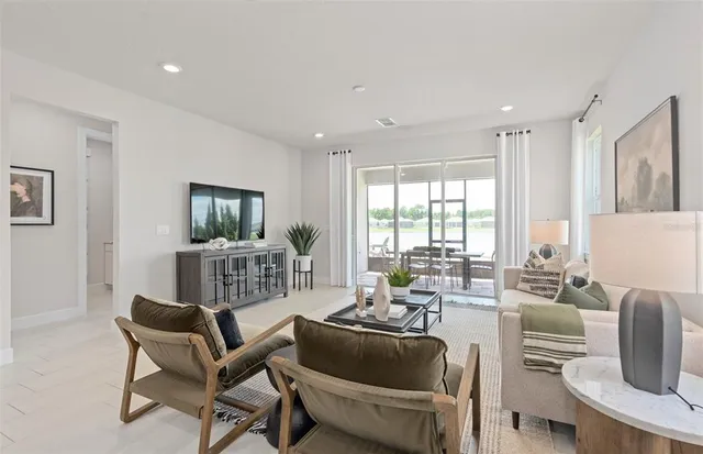 a spacious bedroom with a bed and a window