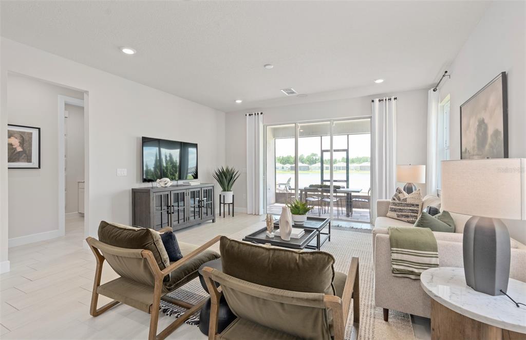 6249 Dew Drop Loop St. Cloud, FL 34771 - Photo 14 of 26 a living room with furniture and a window