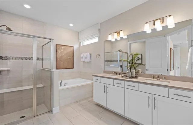 a bathroom with a bathtub and a shower