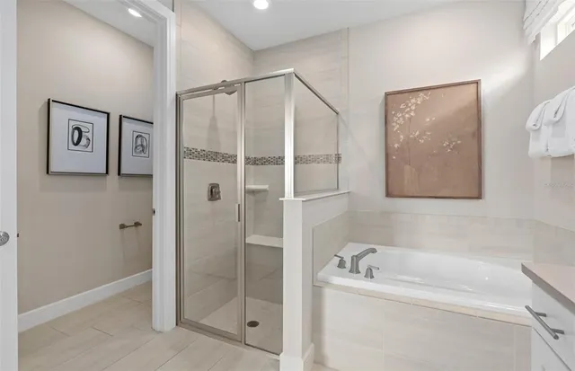 a bedroom with a bed and a potted plant