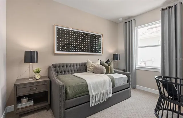 a bedroom with a bed and a table