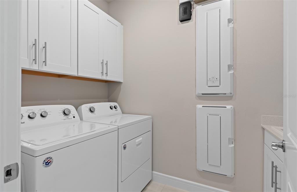 6249 Dew Drop Loop St. Cloud, FL 34771 - Photo 26 of 26 a utility room with dryer and washer