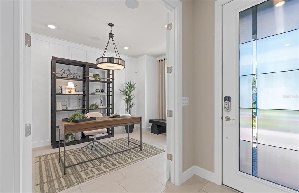 6249 Dew Drop Loop St. Cloud, FL 34771 - Photo 4 of 26 a living room with furniture a window and appliances