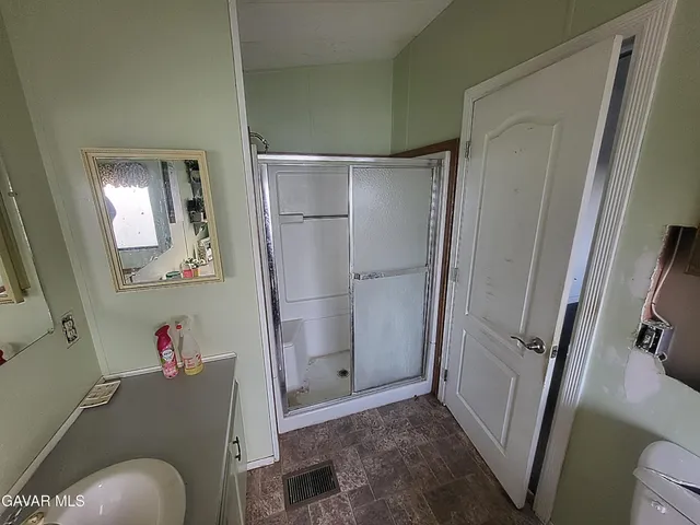 a bathroom with a tub and a shower