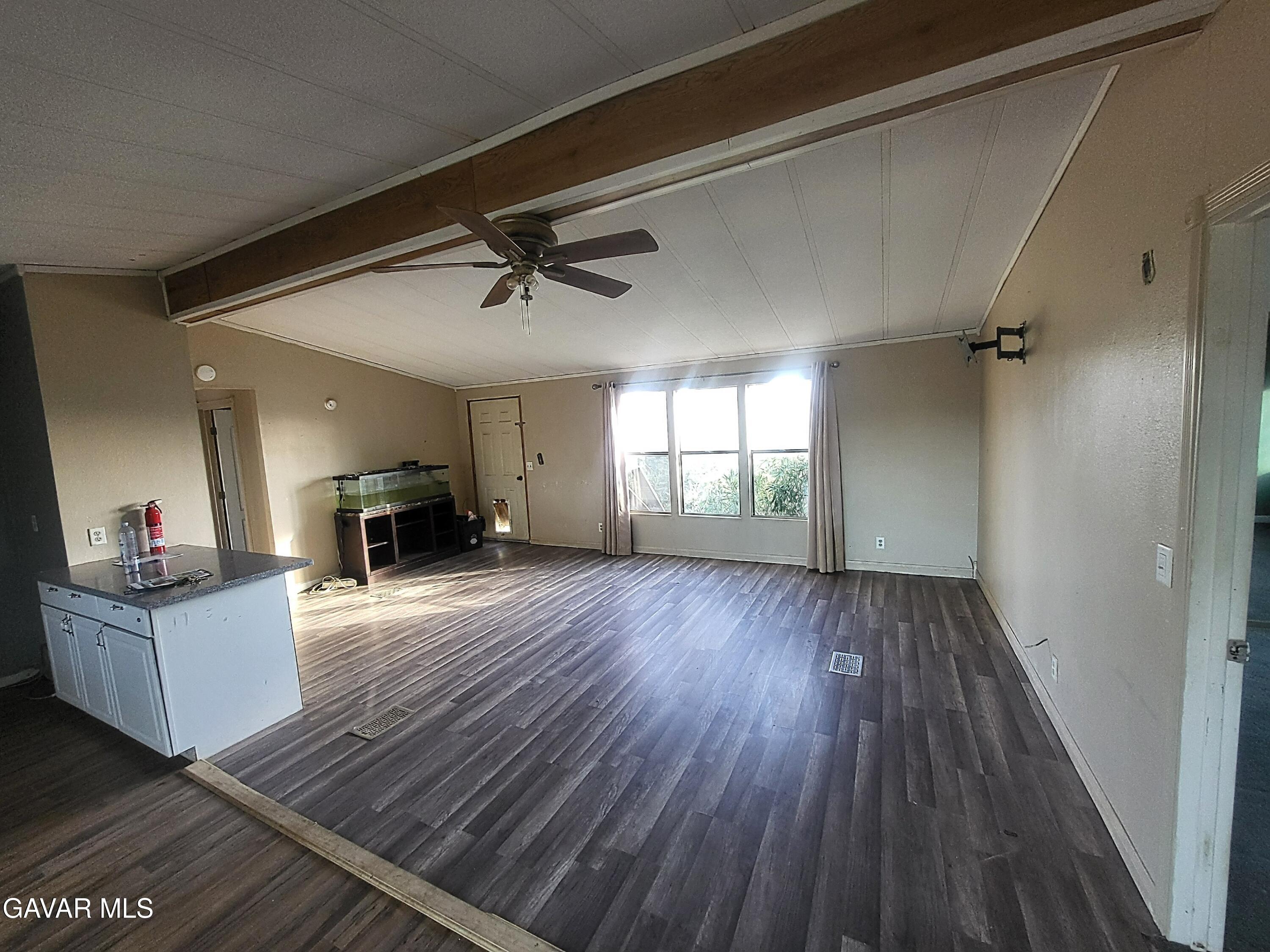 8667 70th Street West Mojave, CA 93501 - Photo 17 of 32 a living room with furniture and a wooden floor