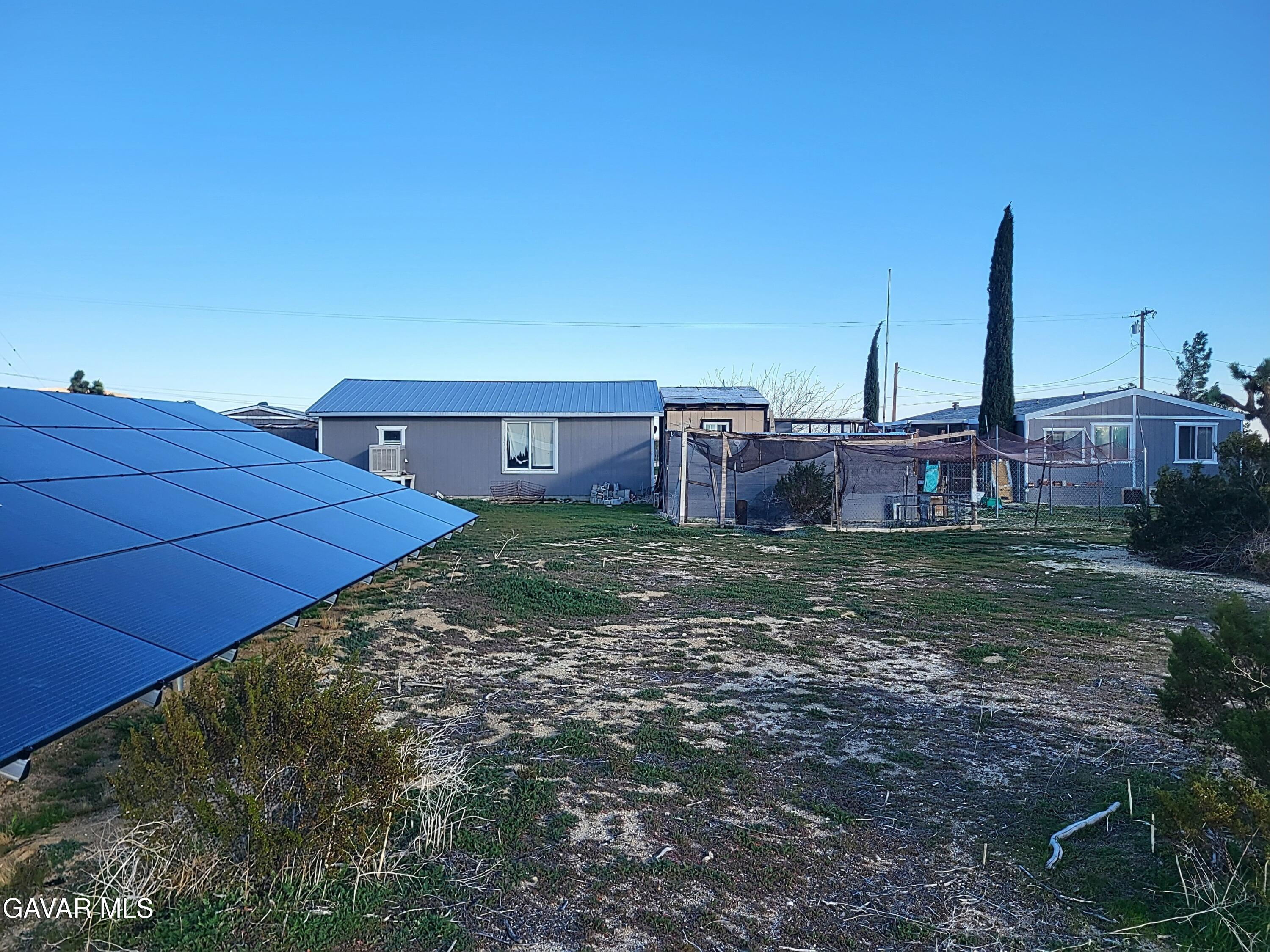 8667 70th Street West Mojave, CA 93501 - Photo 26 of 32 a view of a backyard with a garden
