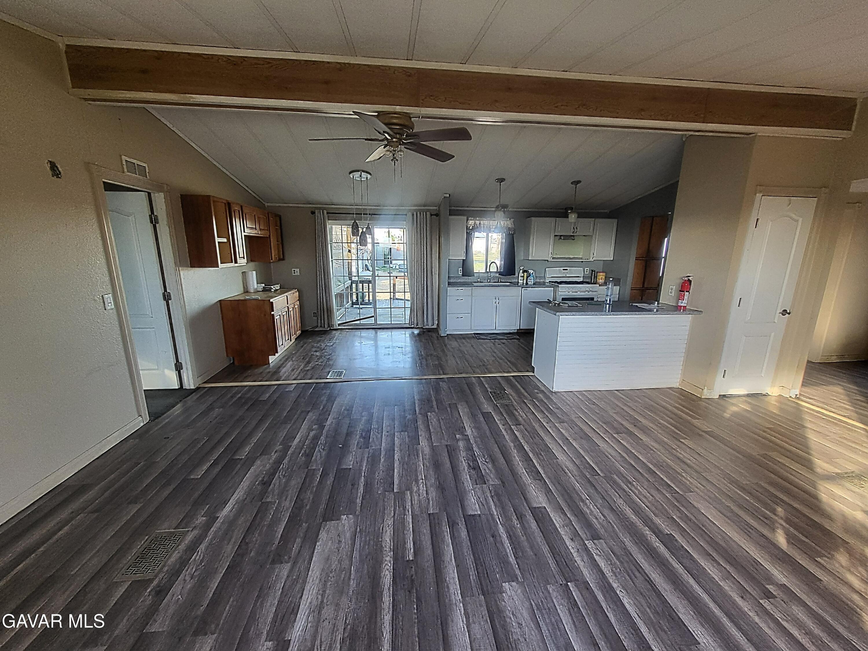 8667 70th Street West Mojave, CA 93501 - Photo 6 of 32 a view of a living room with wooden floor and furniture