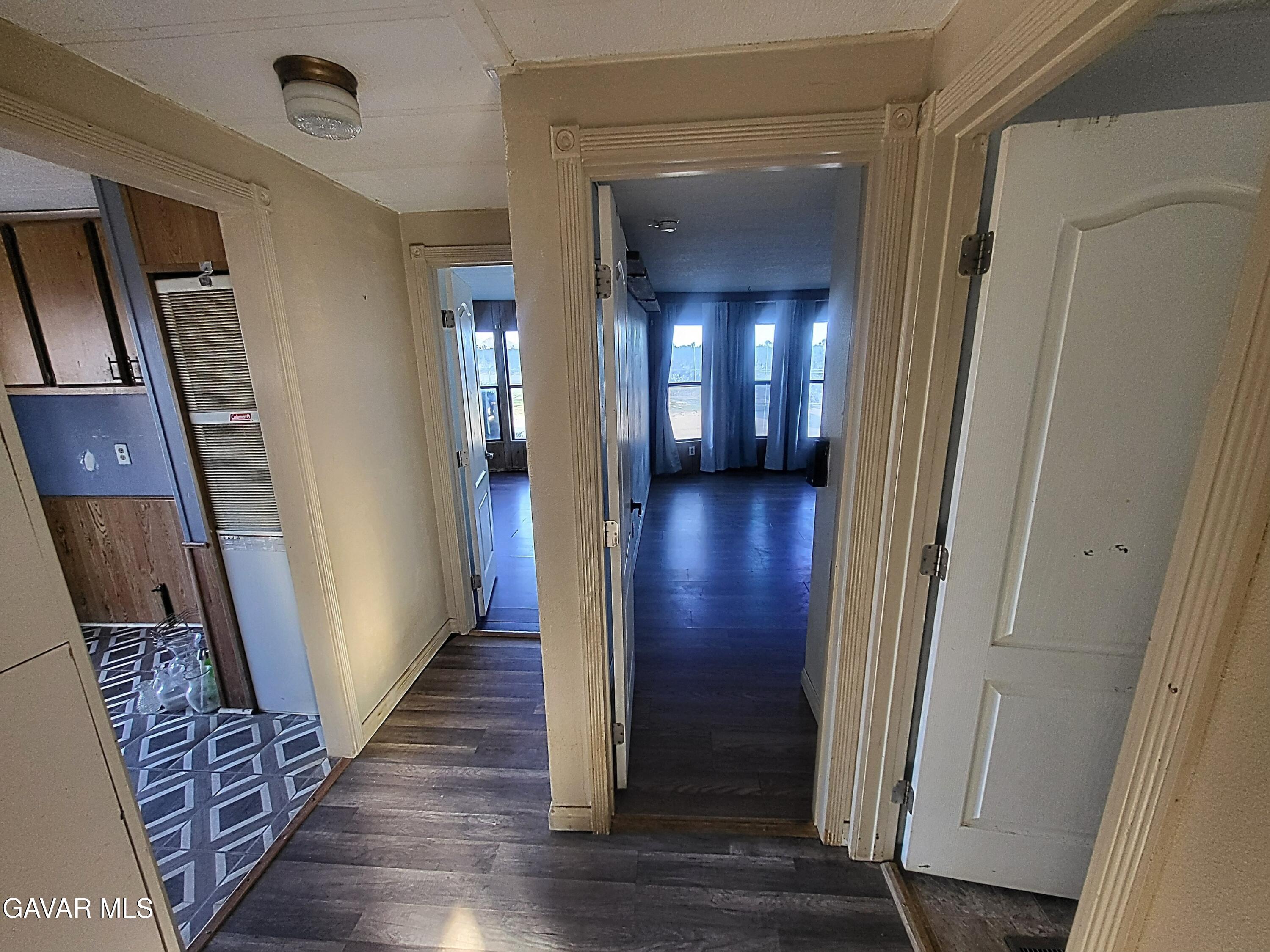 8667 70th Street West Mojave, CA 93501 - Photo 7 of 32 a view of a hallway with wooden floor