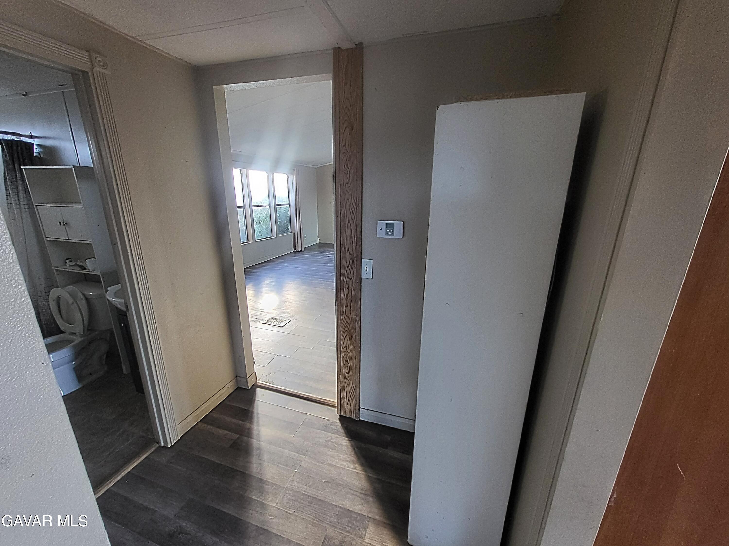 8667 70th Street West Mojave, CA 93501 - Photo 8 of 32 a view of hallway with wooden floor