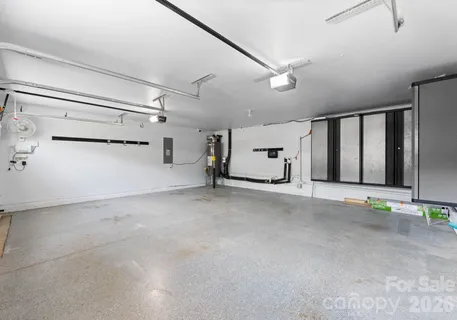 a view of a house with a backyard and a garage