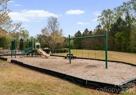 a view of kitchen with livingroom and wooden floor
