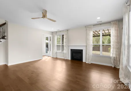 a view of a kitchen with a sink cabinets and wooden floor