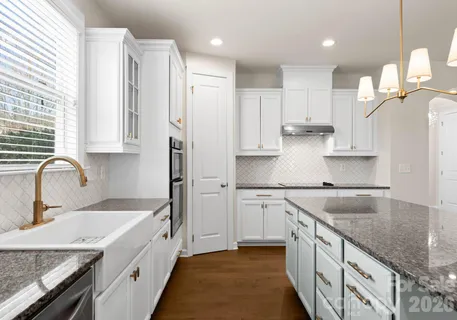 a kitchen with counter top space appliances and a center island