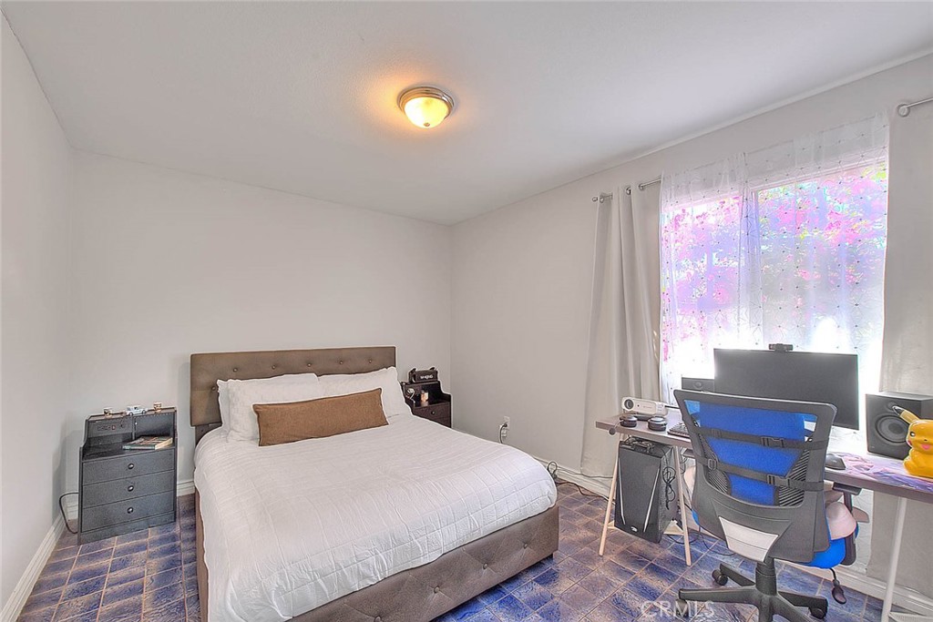 17860 East Laxford Road Azusa, CA 91702 - Photo 18 of 52 a bedroom with a bed and wooden floor