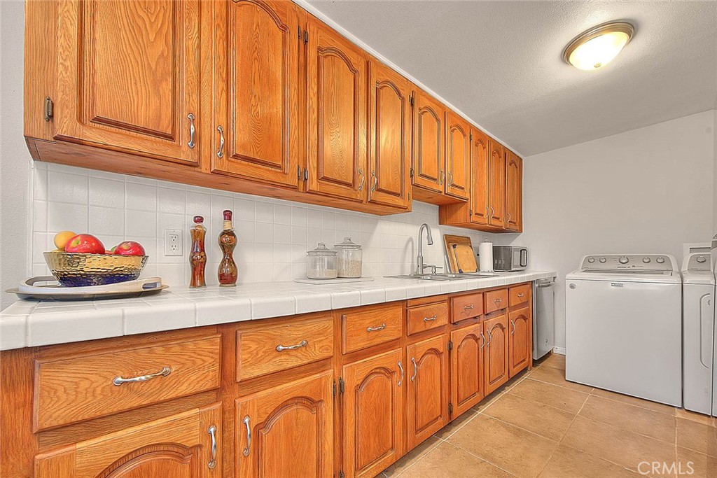17860 East Laxford Road Azusa, CA 91702 - Photo 8 of 52 a kitchen with granite countertop cabinets stainless steel appliances and wooden cabinets