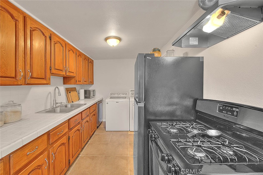 17860 East Laxford Road Azusa, CA 91702 - Photo 9 of 52 a kitchen with stainless steel appliances granite countertop a sink stove and refrigerator