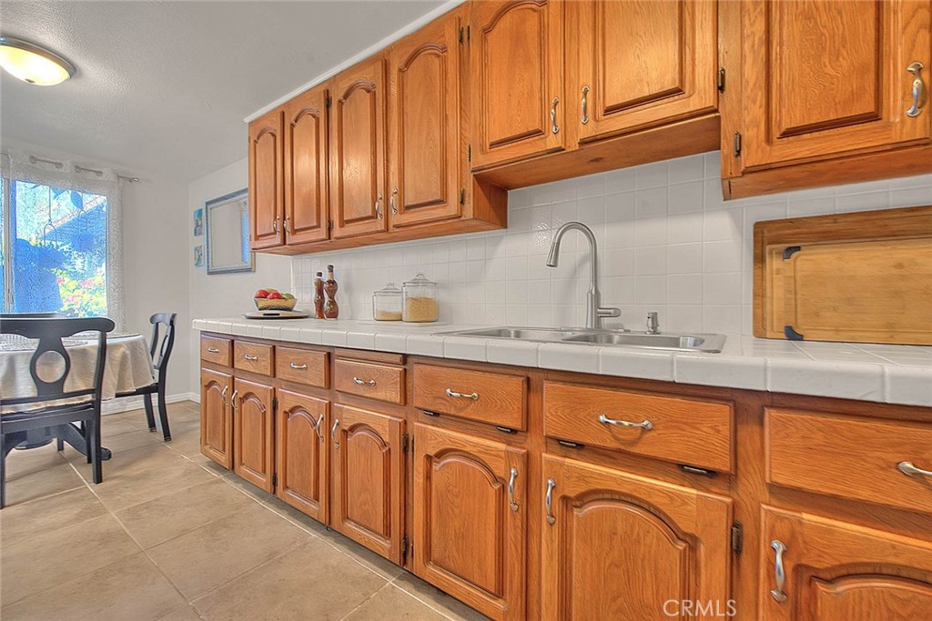 17860 East Laxford Road Azusa, CA 91702 - Photo 10 of 52 a kitchen with stainless steel appliances granite countertop wooden cabinets a sink and dishwasher